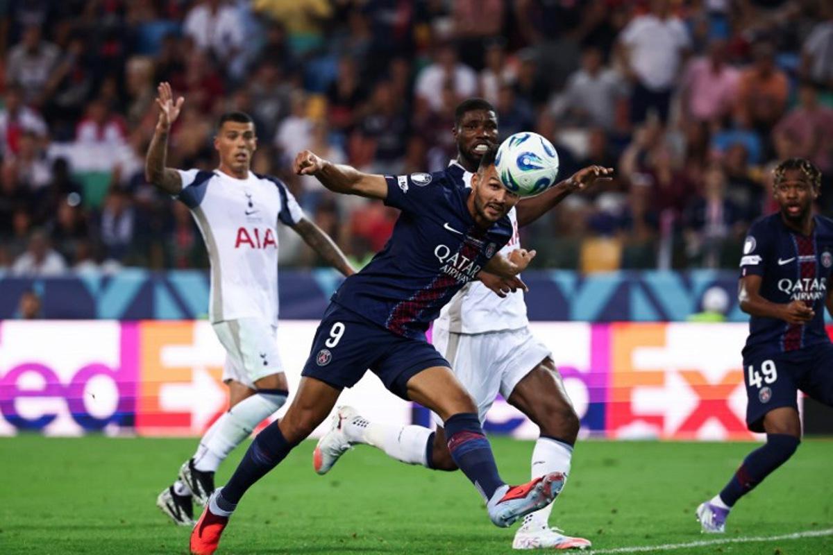 Paris Saint-Germain's Portuguese forward #09 Goncalo Ramos heads the ball to score PSG's second goal during the 2025 UEFA Super Cup final football match between Paris Saint-Germain (FRA) and Tottenham Hotspur FC (ENG) at the Friuli stadium, in Udine, on August 13, 2025.  FRANCK FIFE / AFP