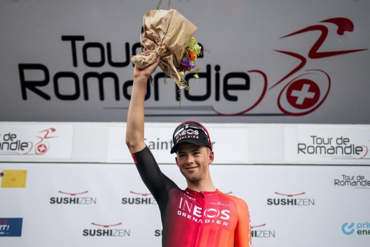 Great Britain's Samuel Watson (Ineos) celebrates his victory during the podium ceremony for the prologue of the Tour of Romandie UCI cycling World tour, a 3.4 km time trial from Saint-Imier to Saint-Imier, on April 29, 2025.  Fabrice COFFRINI / AFP