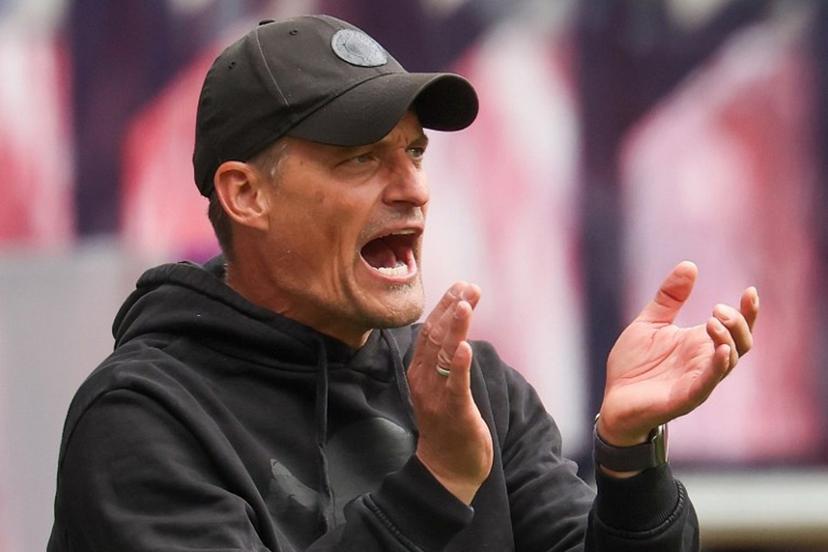St Pauli's German head coach Alexander Blessin applauds his players from the sidelines during the German first division Bundesliga football match between RB Leipzig and St Pauli in Leipzig, eastern Germany, on May 9, 2026.  Odd ANDERSEN / AFP