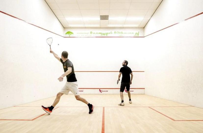 Visitors hit their ball at Squash Utrecht in Utrecht, on April 10, 2021.  The accommodation is the very first indoor sports location that is allowed to reopen after the lockdown ; a negative Covid-19 test certificate is required to enter.  Remko de Waal / ANP / AFP Netherlands OUT

