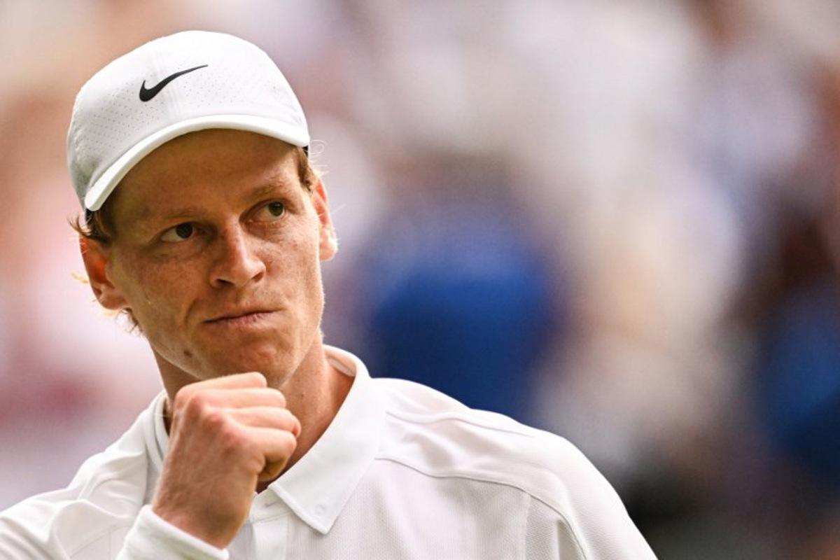 Italy's Jannik Sinner reacts after winning a game against Spain's Carlos Alcaraz during their men's singles final tennis match on the fourteenth day of the 2025 Wimbledon Championships at The All England Lawn Tennis and Croquet Club in Wimbledon, southwest London, on July 13, 2025.  Kirill KUDRYAVTSEV / AFP