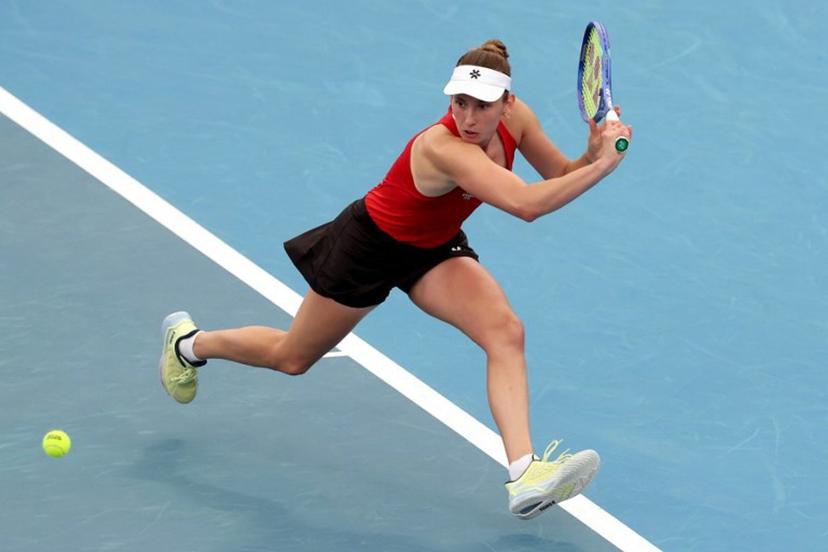 Belgium's Elise Mertens hits a return to China's Zhu Lin during their women's singles match at the United Cup tennis tournament on Ken Rosewall Arena in Sydney on January 3, 2026.  DAVID GRAY / AFP