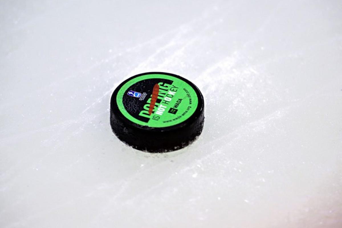 The puck is pictured during the IIHF Men's Ice Hockey World Championship final match between Switzerland and USA in Stockholm, on May 25, 2025.  Magnus LEJHALL / TT NEWS AGENCY / AFP