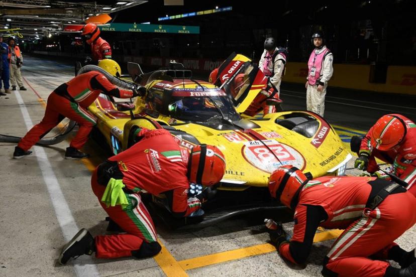 Ferrari AF Corse Thor Team's hypercar #83  Poland  driver Robert Kubica refuels in his pit during the 2025 Le Mans 24 hour endurance race, at the Le Mans circuit, in northwestern France, on June 15, 2025.  JEAN-FRANCOIS MONIER / AFP