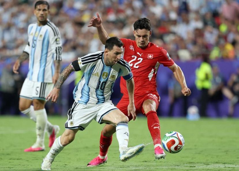 Argentina's forward #10 Lionel Messi and Switzerland's forward #22 Fabian Rieder fight for the ball during the 2026 World Cup football tournament quarter-final match between Argentina and Switzerland at the Kansas City Stadium in Kansas City on July 11, 2026.   Thomas COEX / AFP