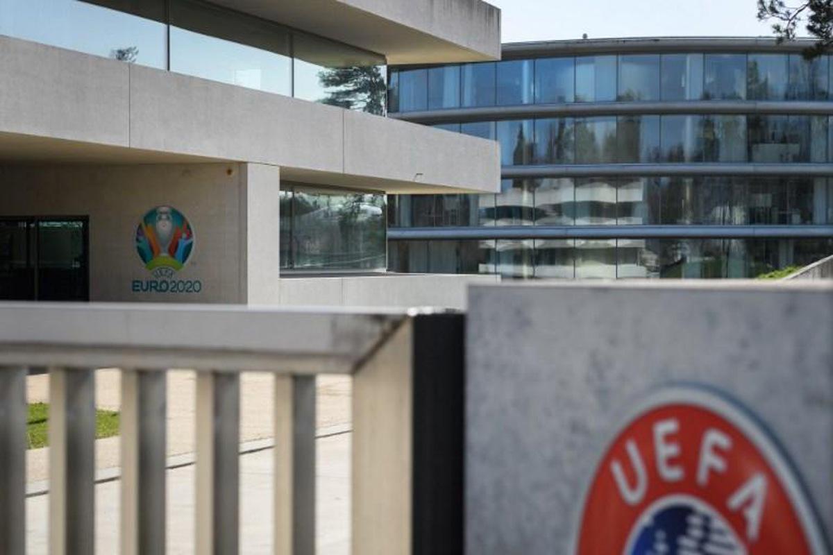 This photograph taken in Nyon on March 17, 2020, shows the Euro 2020 logo at the headquarters of UEFA, the European football's governing body, amid spread of novel coronavirus, COVID-19. UEFA has proposed postponing the European Championship, due to take place across the continent in June and July this year, until 2021 at crisis meetings on Tuesday, a source close to European football's governing body told AFP.  Fabrice COFFRINI / AFP
