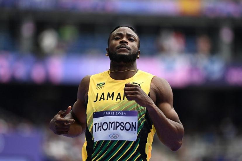 Jamaica's Kishane Thompson reacts after competing in the men's 100m heat of the athletics event at the Paris 2024 Olympic Games at Stade de France in Saint-Denis, north of Paris, on August 3, 2024.  Jewel SAMAD / AFP