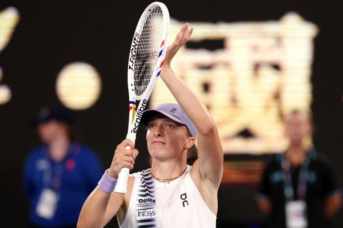 Poland's Iga Swiatek celebrates victory over China's Yuan Yue after their women's singles match on day two of the Australian Open tennis tournament in Melbourne on January 19, 2026.  DAVID GRAY / AFP