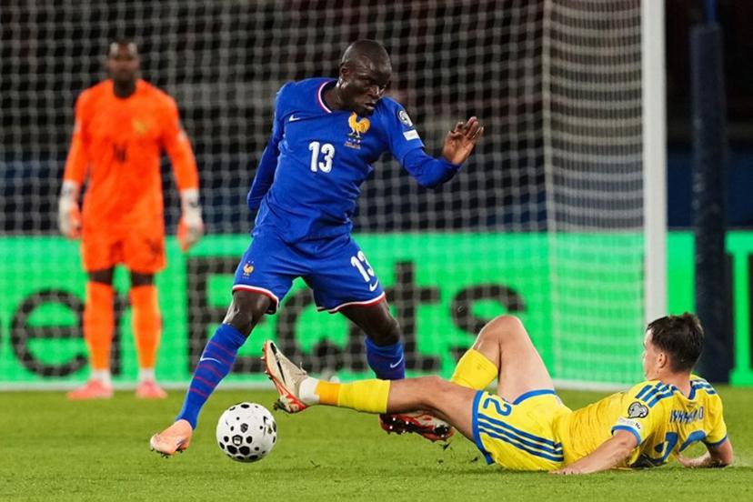 France's midfielder #13 N'Golo Kante (L) fights for the ball with Ukraine's defender #22 Taras Mykhavko during the 2026 World Cup qualifiers Europe zone group D football match between France and Ukraine at the Parc des Princes stadium in Paris, on November 13, 2025.   Dimitar DILKOFF / AFP