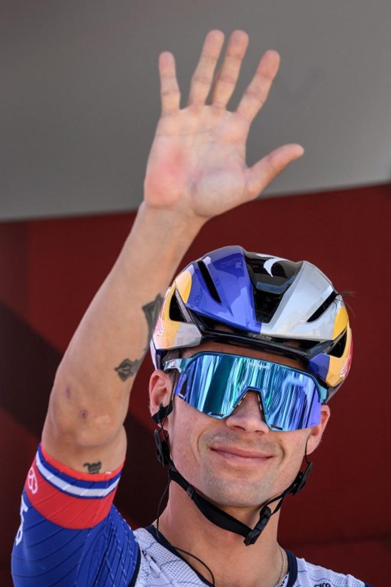 Red Bull-BORA-hansgrohe's Slovenian rider Primoz Roglic waves during the team presentation of the second stage of the Men's Tour of Switzerland (Tour de Suisse) cycling race in Locarno, Switzerland, on June 18, 2026.  Fabrice COFFRINI / AFP