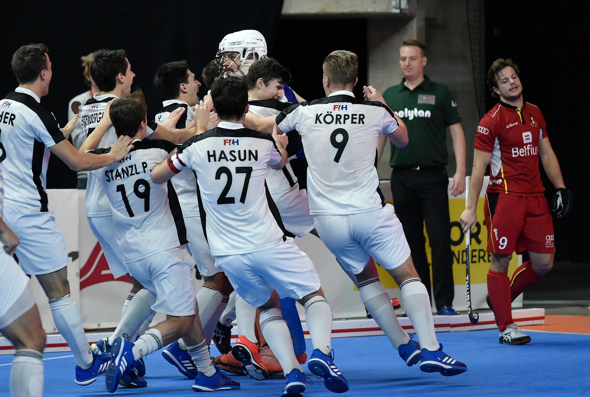 Austrian players celebrate after winning the hockey match between Belgium and Austria, the finals of the EuroHockey Indoor Championship, in Antwerp, Sunday 14 January 2018. BELGA PHOTO JOHN THYS