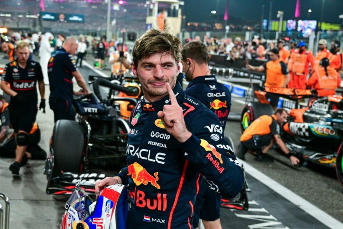 Red Bull Racing's Dutch driver Max Verstappen reacts after taking the pole position at the end of the qualifying session ahead of the Abu Dhabi Formula One Grand Prix at the Yas Marina Circuit in Abu Dhabi on December 6, 2025.  Andrej ISAKOVIC / AFP