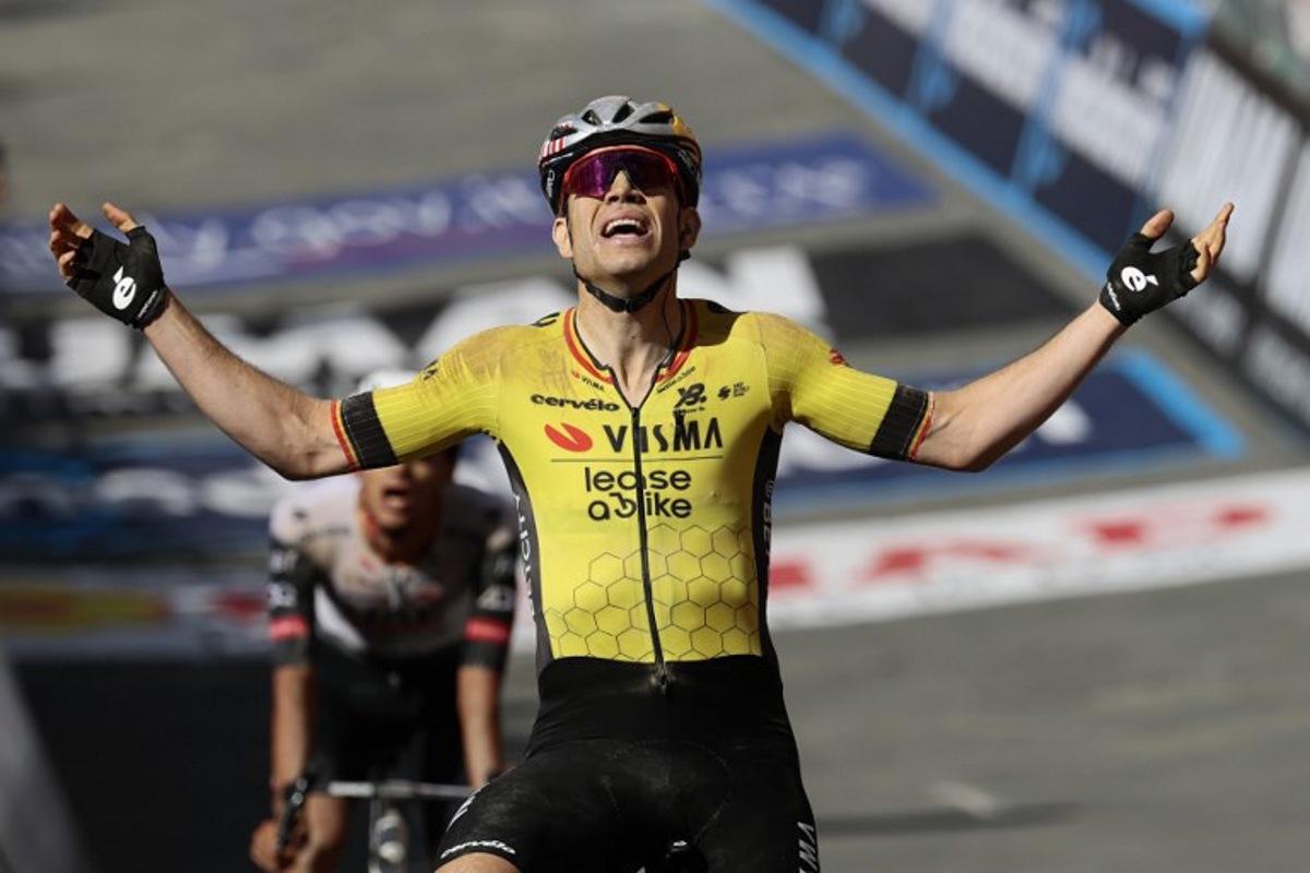 Team Visma-Lease a Bike's Belgian rider Wout Van Aert celebrates after victory as he crosses the finish of the 9th stage of the 108th Giro d'Italia cycling race of 181kms from Gubbio to Siena on May 18, 2025.  Luca Bettini / AFP