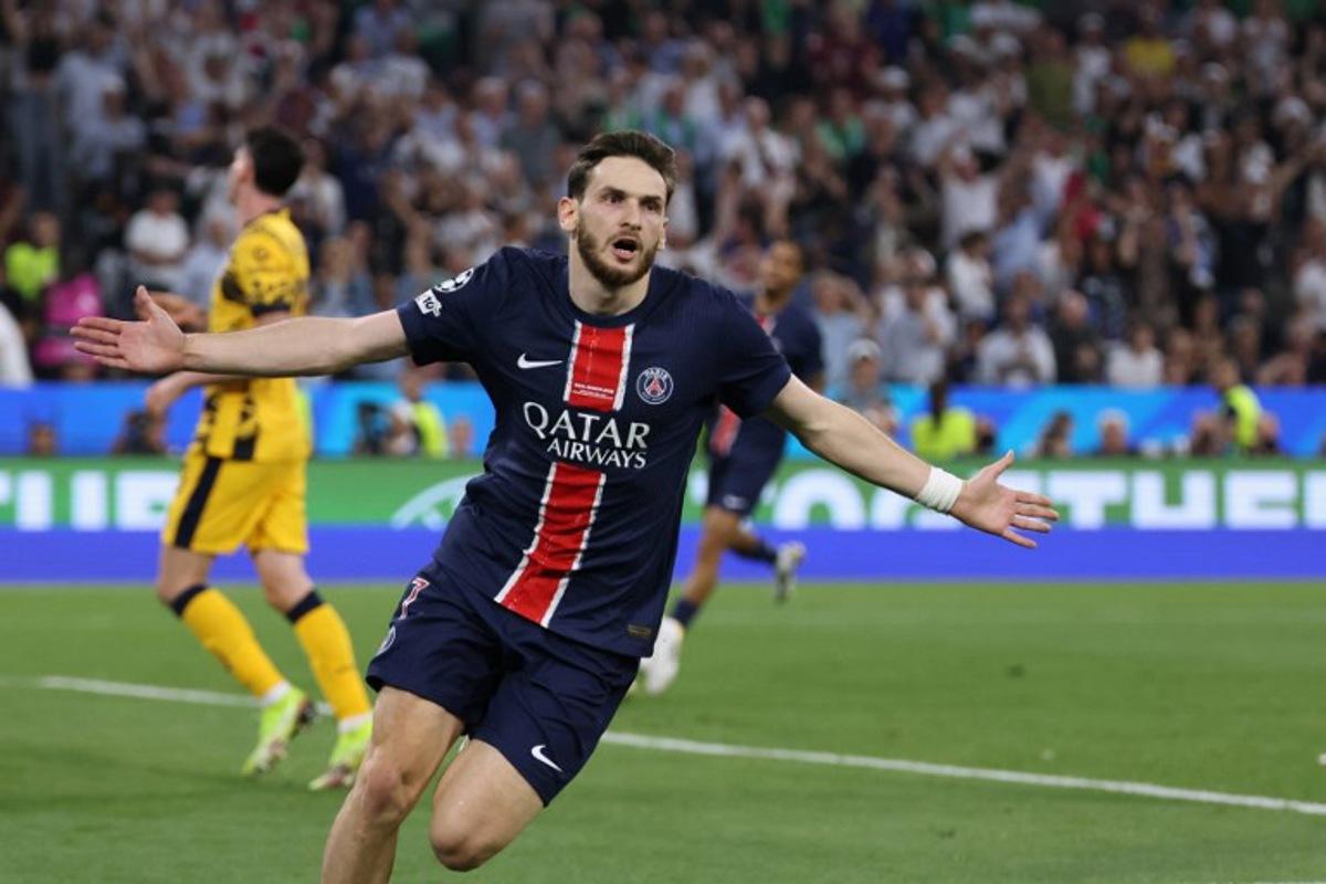 Paris Saint-Germain's Georgian forward #07 Khvicha Kvaratskhelia celebrates after scoring PSG's fourth goal during the UEFA Champions League final football match between Paris Saint-Germain (PSG) and Inter Milan in Munich, southern Germany, on May 31, 2025.  FRANCK FIFE / AFP