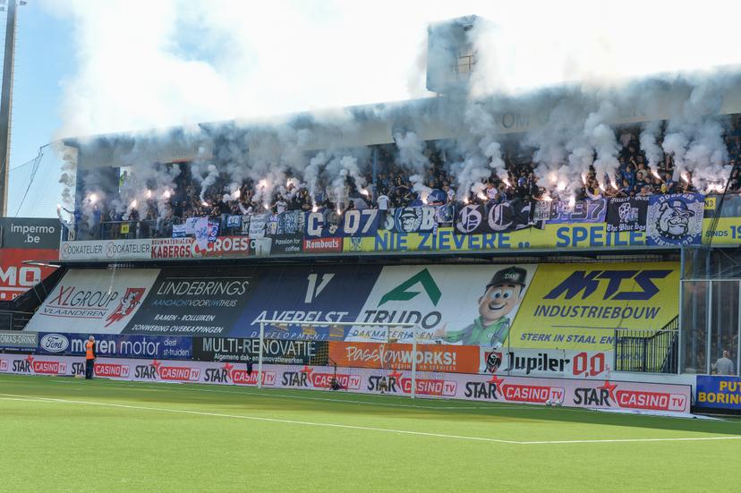 Supporters with fireworks and smoke bombs pictured during a soccer match between Sint-Truidense V.V. and KRC Genk, Sunday 28 September 2025 in Sint-Truiden, on day 9 of the 2025-2026 'Jupiler Pro League' first division of the Belgian championship. BELGA PHOTO JILL DELSAUX