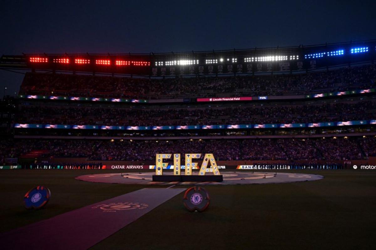 A FIFA logo is seen on the pitch ahead of the FIFA Club World Cup 2025 quarterfinal football match between Brazil's Palmeiras and England's Chelsea at the Lincoln Financial Field Stadium in Philadelphia on July 4, 2025.  JUAN MABROMATA / AFP