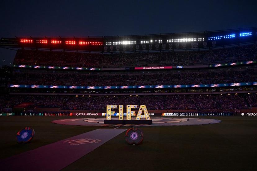 A FIFA logo is seen on the pitch ahead of the FIFA Club World Cup 2025 quarterfinal football match between Brazil's Palmeiras and England's Chelsea at the Lincoln Financial Field Stadium in Philadelphia on July 4, 2025.  JUAN MABROMATA / AFP