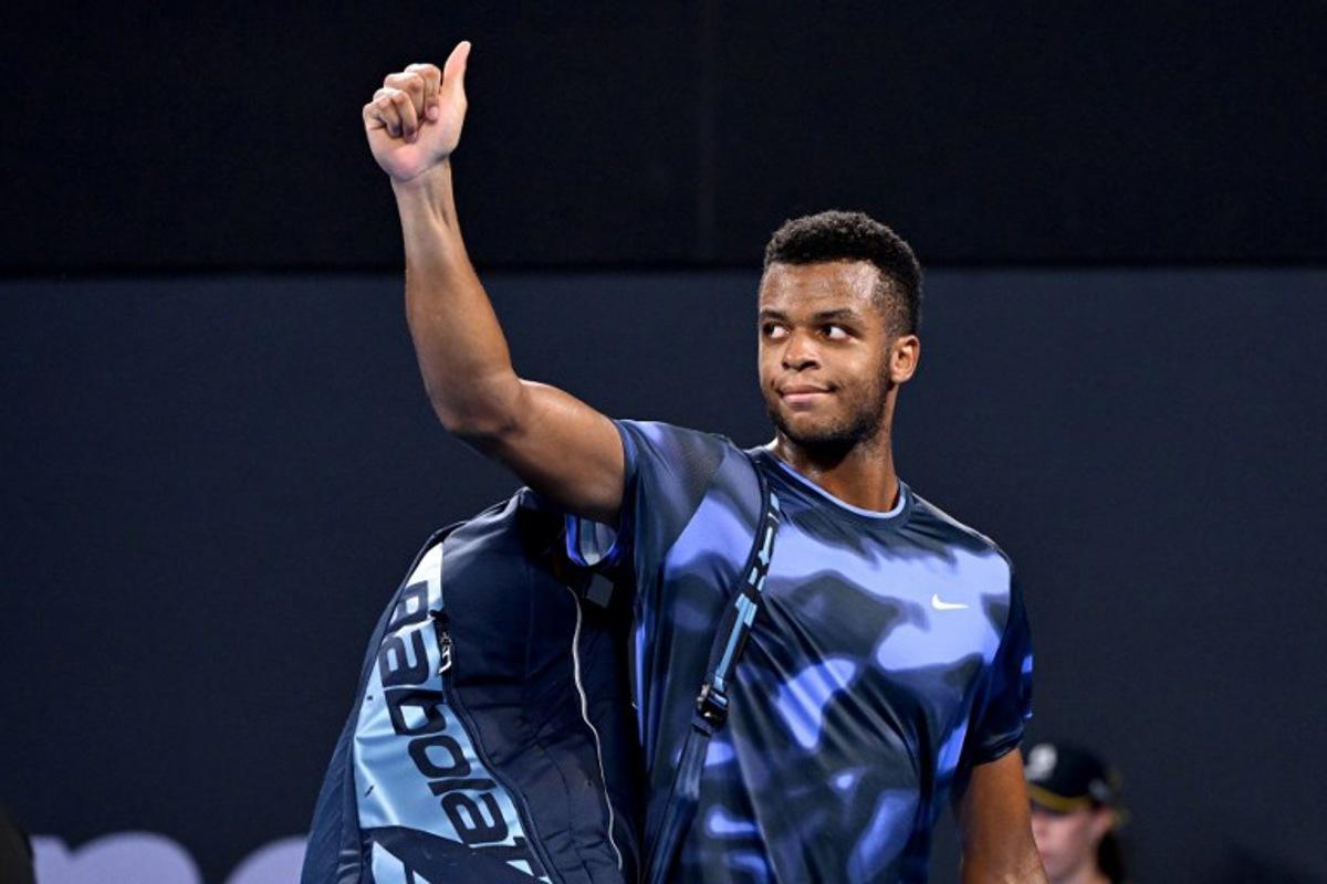 France's Giovanni Mpetshi Perricard walks off court after his defeat against USA's Reilly Opelka in their men's singles semi-final match at the Brisbane International tennis tournament in Brisbane on January 4, 2025.  William WEST / AFP