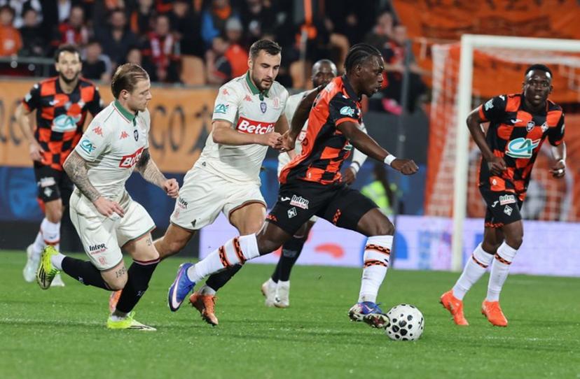 Lorient's French midfielder #17 Jean-Victor Makengo fights for the ball with Nice's Belgian midfielder #24 Charles Vanhoutte and Nice's French defender #26 Melvin Bard during the French Cup quarter final football match between FC Lorient and OGC Nice at the Stade du Moustoir stadium in Lorient, western France on March 4, 2026.  Fred TANNEAU / AFP