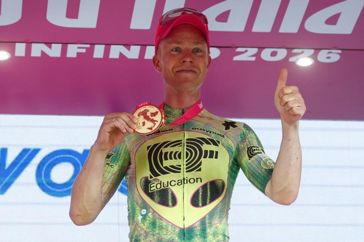 EF Education - EasyPost Danish rider Michael Valgren poses on the podium after winning the 17th stage of the Giro d'Italia 2026 - Tour of Italy cycling race between Cassano d'Adda and Andalo, Italy, on May 27, 2026.  Luca Bettini / AFP