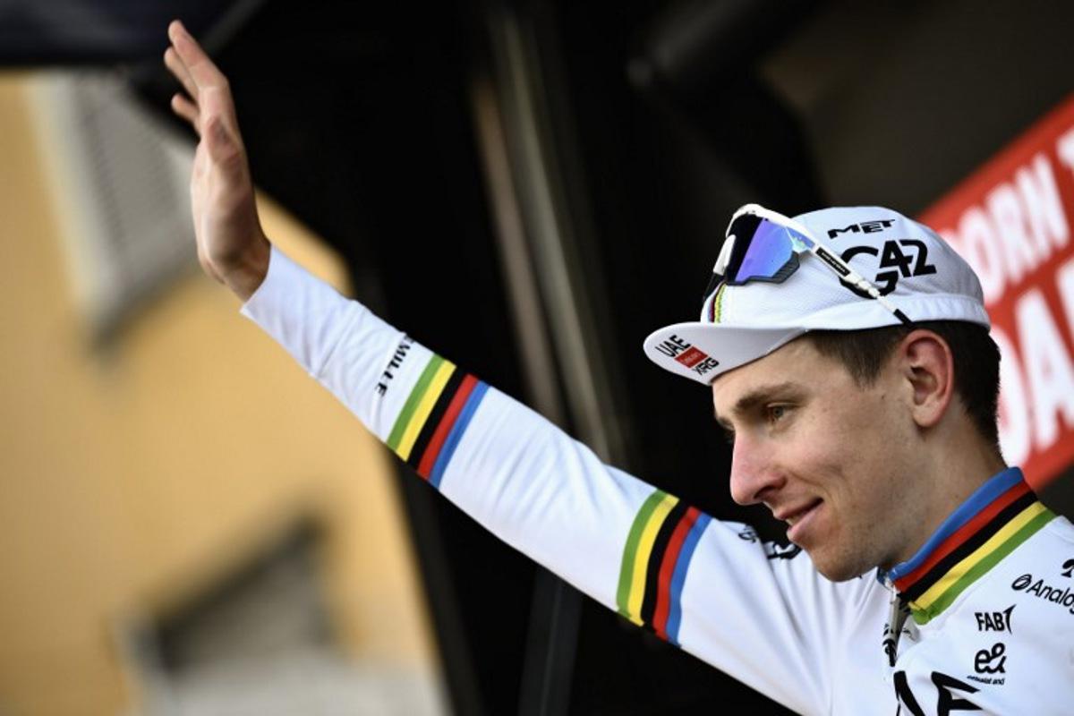 UAE Team Emirates's Slovenian rider Tadej Pogacar celebrates his victory on the podium after the 119th edition of the Giro di Lombardia (Tour of Lombardy), a 238km cycling race from Como to Bergamo on October 11, 2025.  Marco BERTORELLO / AFP