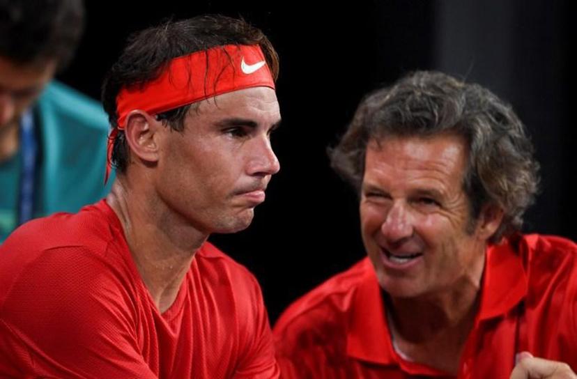 Rafael Nadal of Spain (L) listens to coach Francisco Roig in his men's singles match against David Goffin of Belgium at the ATP Cup tennis tournament in Sydney on January 10, 2020.  William WEST / AFP --IMAGE RESTRICTED TO EDITORIAL USE - NO COMMERCIAL USE--

