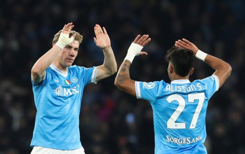 Napoli's Danish forward Rasmus #19 Hojlund celebrates with teammate Napoli's Brazilian forward #27 Allison Santos after scoring his team's first goal during the Italian Serie A football match between Napoli and Lecce at the Diego Armando Maradona stadium in Naples, southern Italy, on March 14, 2026.  CARLO HERMANN / AFP