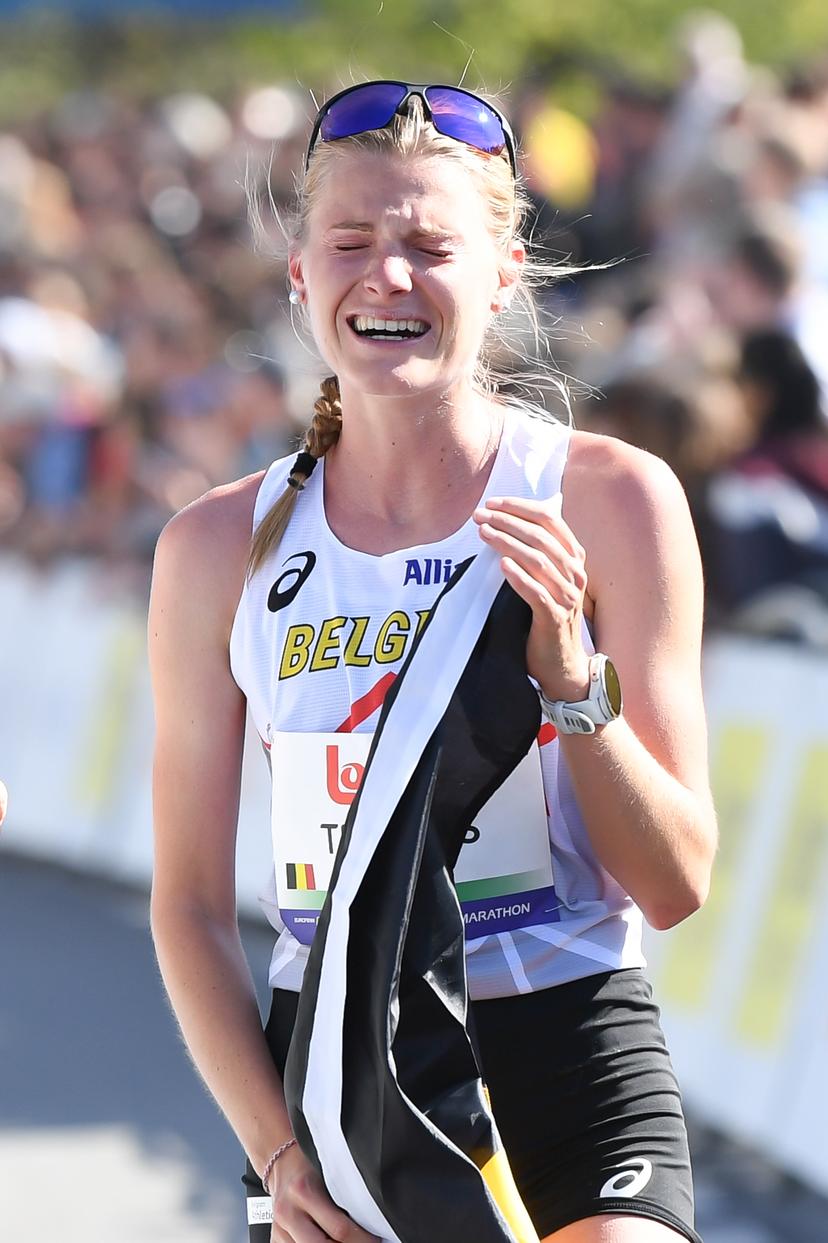 Belgian Juliette Thomas celebrates after the half marathon race at European Running Championships, in Leuven, Saturday 12 April 2025. BELGA PHOTO JILL DELSAUX