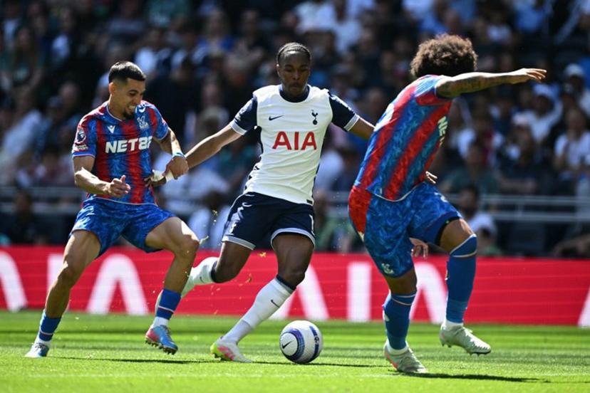 Tottenham Hotspur's French striker #11 Mathys Tel (C) runs at the Palace defence during the English Premier League football match between Tottenham Hotspur and Crystal Palace at the Tottenham Hotspur Stadium in London, on May 11, 2025.  Ben STANSALL / AFP