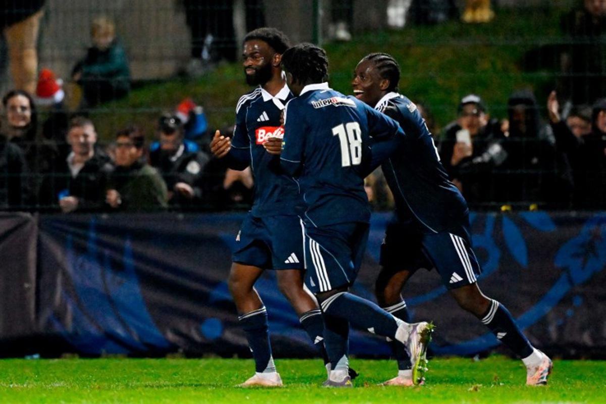 Paris FC's French forward #07 Jonathan Ikone celebrates scoring a penalty during the French Cup  the French Cup round of 64 football match between Raon l'Etape and Paris FC at the Paul-Gasser Stadium, in Raon-l'Etape, eastern France, on December 20, 2025.  Jean-Christophe VERHAEGEN / AFP