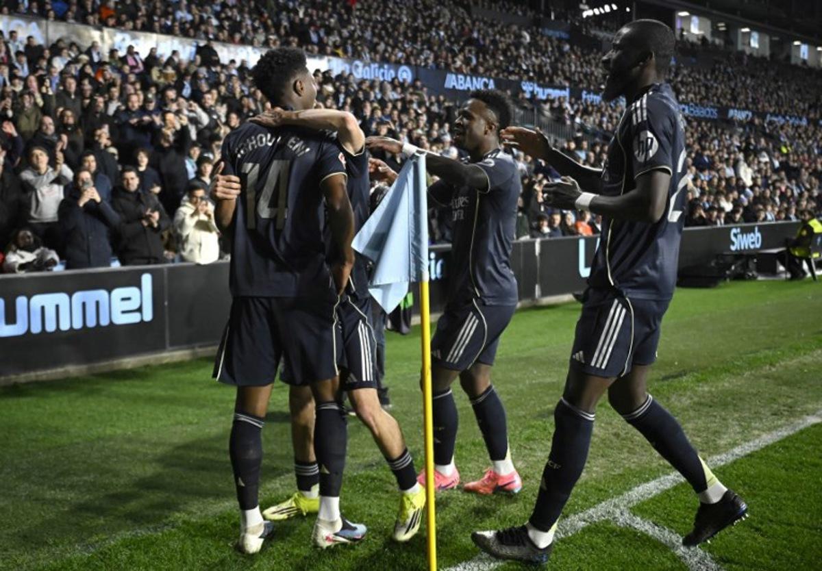 Real Madrid's French midfielder #14 Aurelien Tchouameni (L) celebrates scoring his team's first goal with teammates during the Spanish league football match between Celta Vigo and Real Madrid CF at the Balaidos Stadium in Vigo on March 6, 2026.  Miguel RIOPA / AFP