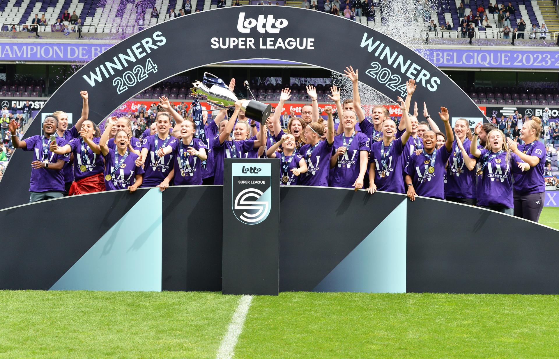 RSCA's players celebrate after winning the Super League women's championship, after a soccer game between RSCA Women and KRC Genk, Saturday 25 May 2024 in Brussels, on day 10/10 of the play-off group A of the Super League women's championship.  BELGA PHOTO JILL DELSAUX