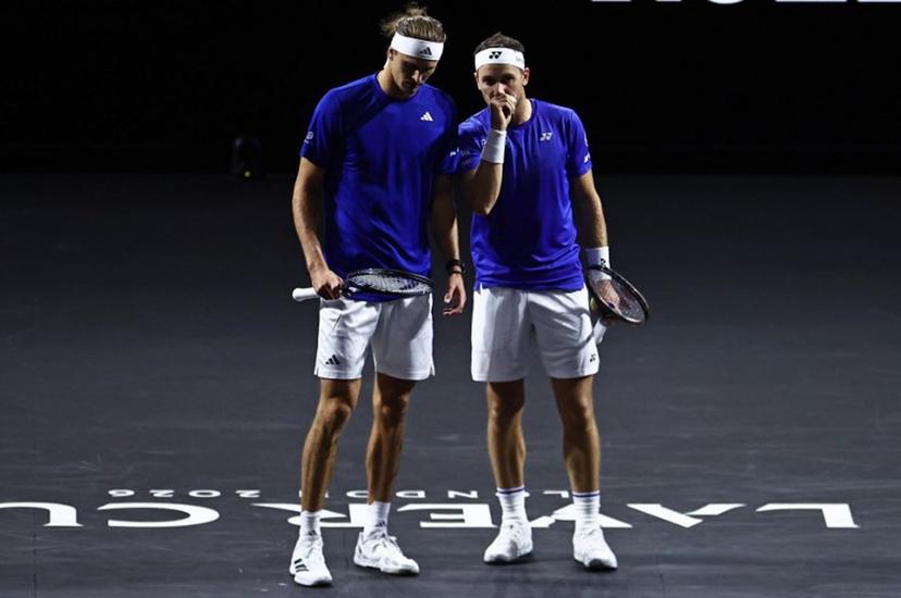 Germany's Alexander Zverev playing with Norway's Casper Ruud for Team Europe look on whilst against USA's Brandon Nakashima and Kazakhstan's Alexander Bublik of Team World during their 2026 Laver Cup men's doubles tennis match, at the O2 Arena in London on September 26, 2026.  Henry Nicholls / AFP