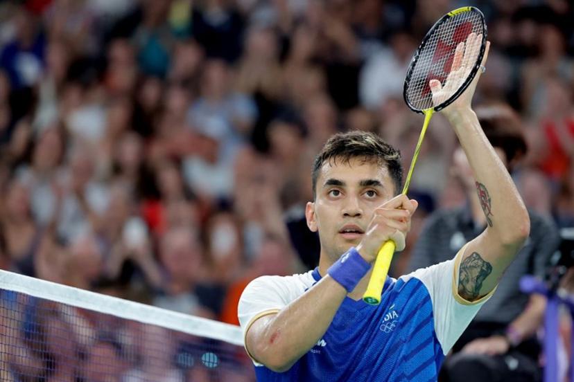 India's Lakshya Sen celebrates his win against Belgium's Julien Carraggi in their men's singles badminton group stage match during the Paris 2024 Olympic Games at Porte de la Chapelle Arena in Paris on July 29, 2024.  David GRAY / AFP