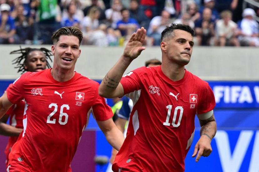 Switzerland's midfielder #10 Granit Xhaka celebrates scoring his team's fourth goal during the 2026 World Cup Group B football match between Switzerland and Bosnia and Herzegovina at Los Angeles Stadium in Inglewood on June 18, 2026.   Frederic J. Brown / AFP