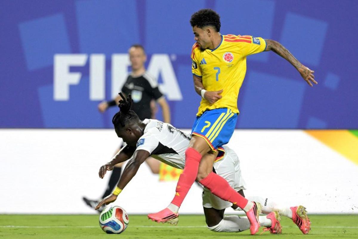 Ghana's defender #02 Alidu Seidu and Colombia's forward #07 Luis Diaz fight for the ball during the 2026 World Cup round of 32 football match between Colombia and Ghana at the Kansas City Stadium in Kansas City on July 3, 2026.   JUAN MABROMATA / AFP