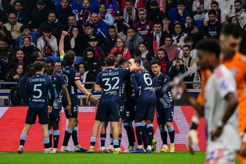 Celta Vigo's players celebrates after Javi Rueda scored a goal during the UEFA Europa League last 16 second leg football match between Olympique Lyonnais (OL) and Celta Vigo at the Groupama Stadium in Lyon, central-eastern France, on March 19, 2026.  OLIVIER CHASSIGNOLE / AFP