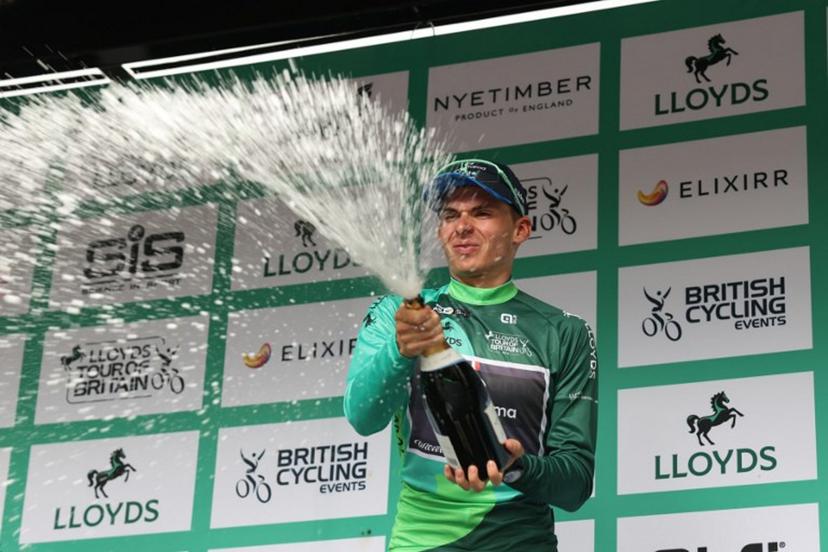 Groupama FGJ's French rider Romain Gregoire sparys the champagne as he celebrate his overall victory in the Tour of Britain cycling race, in Cardiff on September 7, 2025.  Darren Staples / AFP