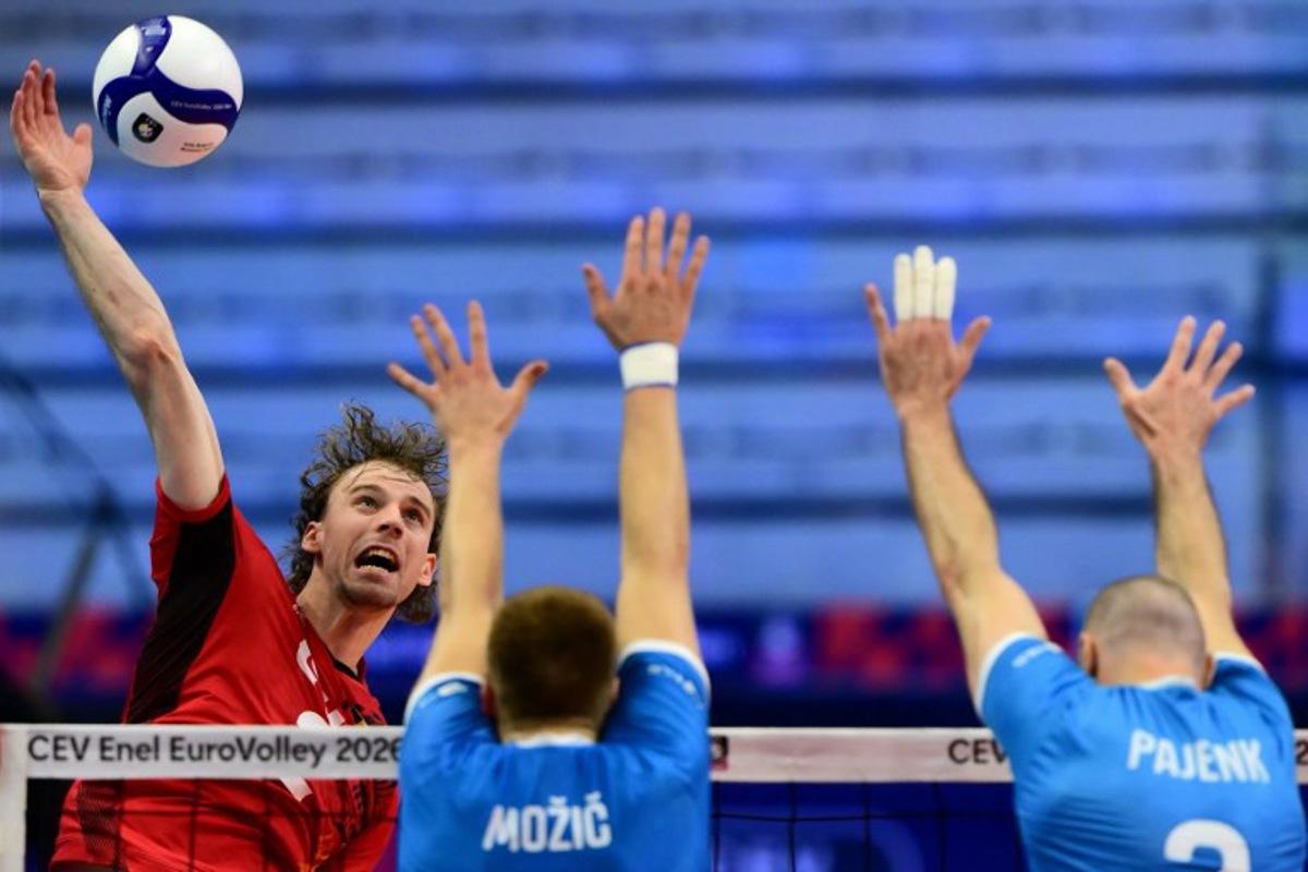 Belgium's Ferre Reggers spikes the ball during the CEV EuroVolley 2026 men's volleyball quarterfinal match between Belgium and Slovenia at the Palavela in Turin on September 23, 2026.  Marco Bertorello / AFP