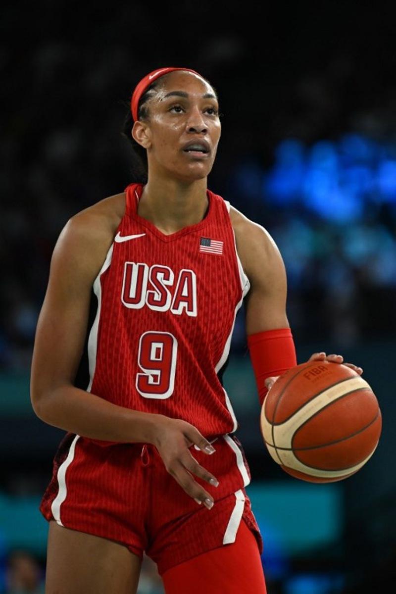 USA's #09 A'ja Wilson prepares to take a free throw in the women's Gold Medal basketball match between France and the USA during the Paris 2024 Olympic Games at the Bercy  Arena in Paris on August 11, 2024.  Paul ELLIS / AFP