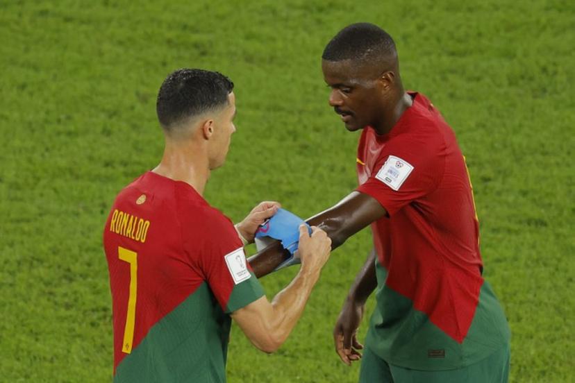Portugal's forward #07 Cristiano Ronaldo gives the captain's armband to Portugal's midfielder #14 William Carvalho as he is replaced during the Qatar 2022 World Cup Group H football match between Portugal and Ghana at Stadium 974 in Doha on November 24, 2022.  Odd ANDERSEN / AFP