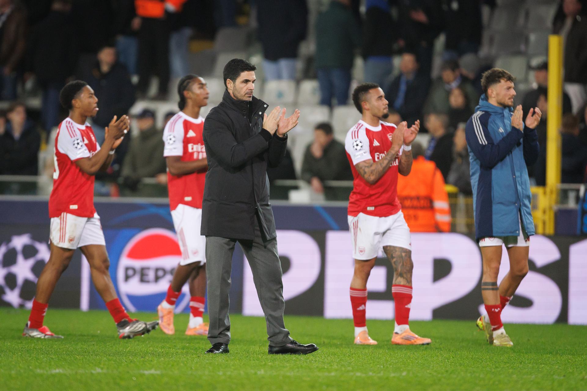 Arsenal's players celebrate after winning a soccer game between Belgian soccer team Club Brugge KV and English Arsenal F.C, on Wednesday 10 December 2025 in Brugge, on day 6 (out of 8) of the League phase of the UEFA Champions League tournament. BELGA PHOTO KURT DESPLENTER