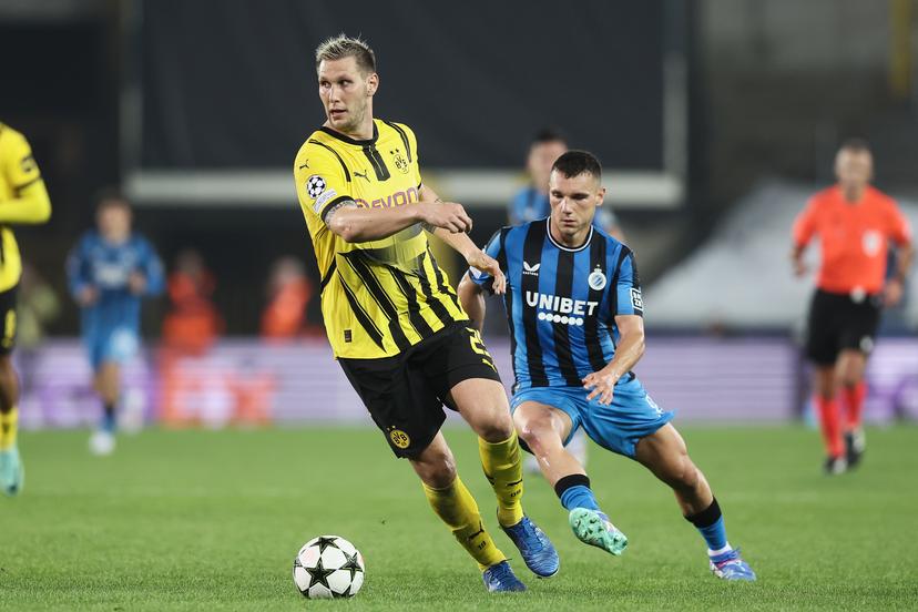 Borussia's Niklas Sule and Club's Ferran Jutgla fight for the ball during a soccer game between Belgian Club Brugge KV and German Borussia Dortmund, Wednesday 18 September 2024 in Brugge, on the day one of the UEFA Champions League league phase. BELGA PHOTO BRUNO FAHY