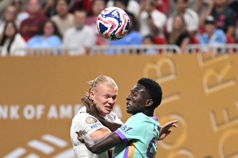 Manchester City's Norwegian striker #09 Erling Haaland and Al Ain's Senegalese defender #56 Amadu Niang fight for the ball during the FIFA Club World Cup 2025 Group G football match between England's Manchester City and UAE's Al Ain FC at the Mercedes-Benz stadium in Atlanta on June 22, 2025.  PATRICIA DE MELO MOREIRA / AFP
