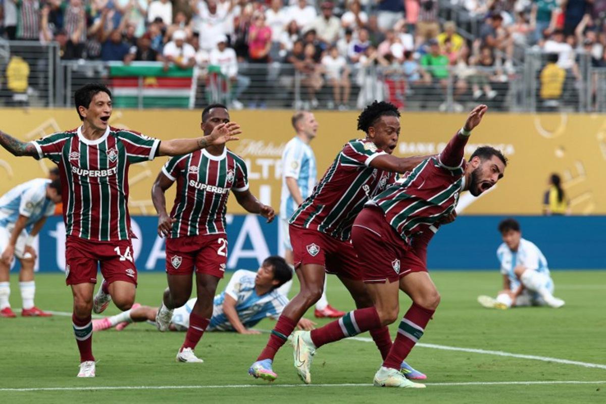 Fluminense's Argentine defender #22 Juan Pablo Freytes (R) celebrates with teammate Brazilian forward #11 Keno after scoring his team's third goal during the FIFA Club World Cup 2025 Group F football match between Brazil's Fluminense and South Korea's Ulsan HD at the MetLife stadium in East Rutherford, New Jersey on June 21, 2025.  FRANCK FIFE / AFP