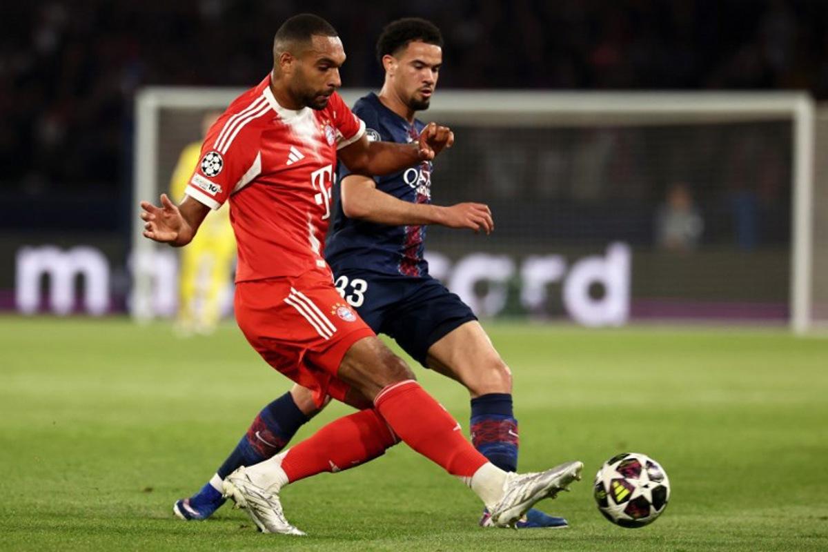 Bayern Munich's German defender #04 Jonathan Tah fights for the ball with Paris Saint-Germain's French midfielder #33 Warren Zaire-Emery during the UEFA Champions League semi-final first leg football match between Paris Saint-Germain (PSG) and Bayern Munich at the Parc des Princes in Paris on April 28, 2026.  FRANCK FIFE / AFP