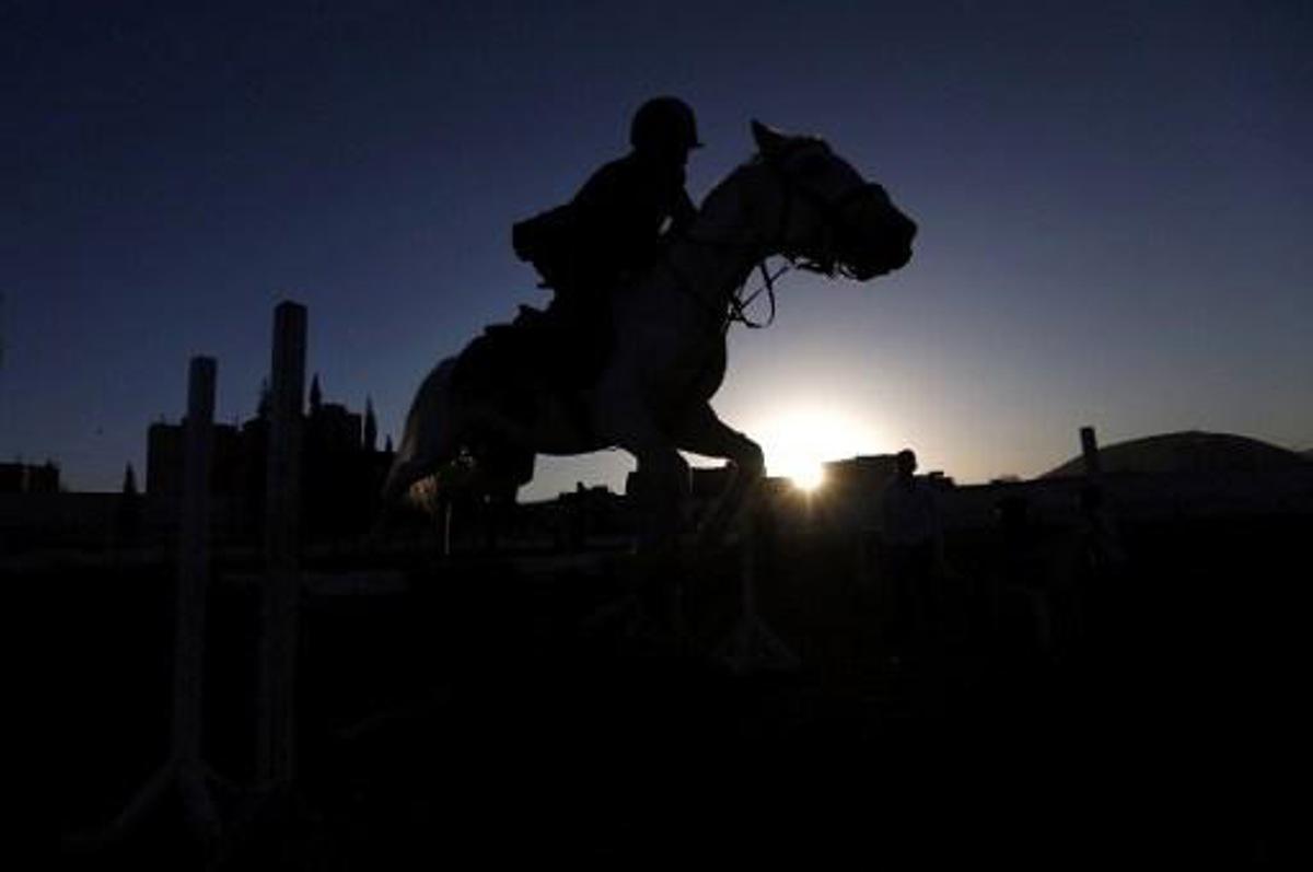 A Yemeni boy competes in the National Horse Jumping Championships in Sanaa on January 9, 2017. 
Mohammed HUWAIS / AFP