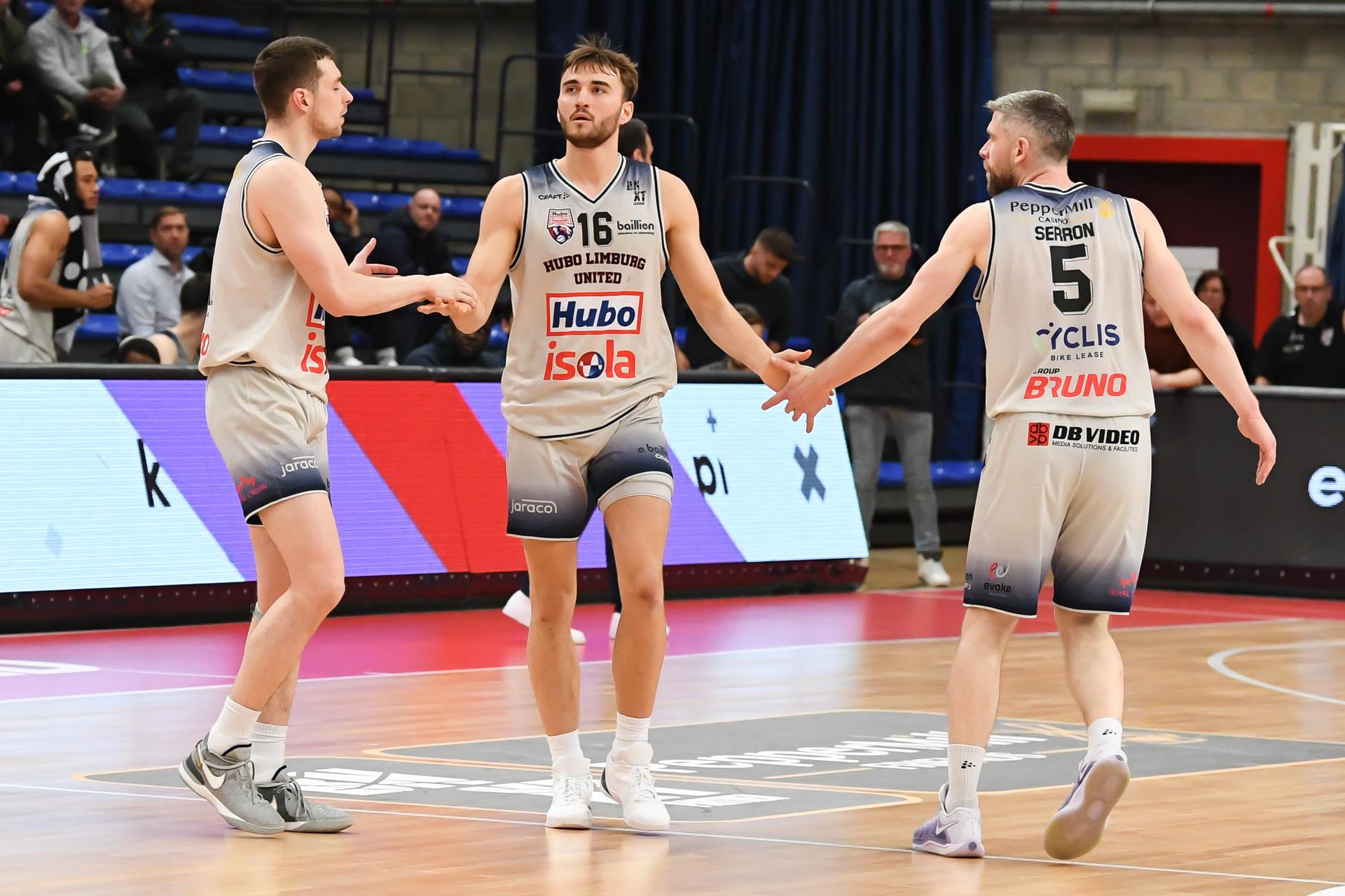 Limburg's Jarne Lesuisse, Limburg's Wout Leemans and Limburg's Quentin Serron celebrate during a basketball match between Limburg United and Spirou Charleroi, Wednesday 12 March 2025 in Hasselt, on day 25 of the 'BNXT League' first division basket championship. BELGA PHOTO JILL DELSAUX