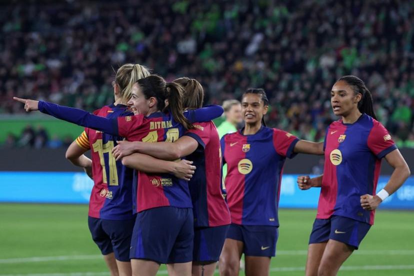 Barcelona players including Spanish midfielder #14 Aitana Bonmati (2nd L) celebrate the opening goal during the UEFA Women's Champions League quarter-final first-leg football match VfL Wolfsburg v FC Barcelona in Wolfsburg, northern Germany, on March 19, 2025.  Ronny HARTMANN / AFP
