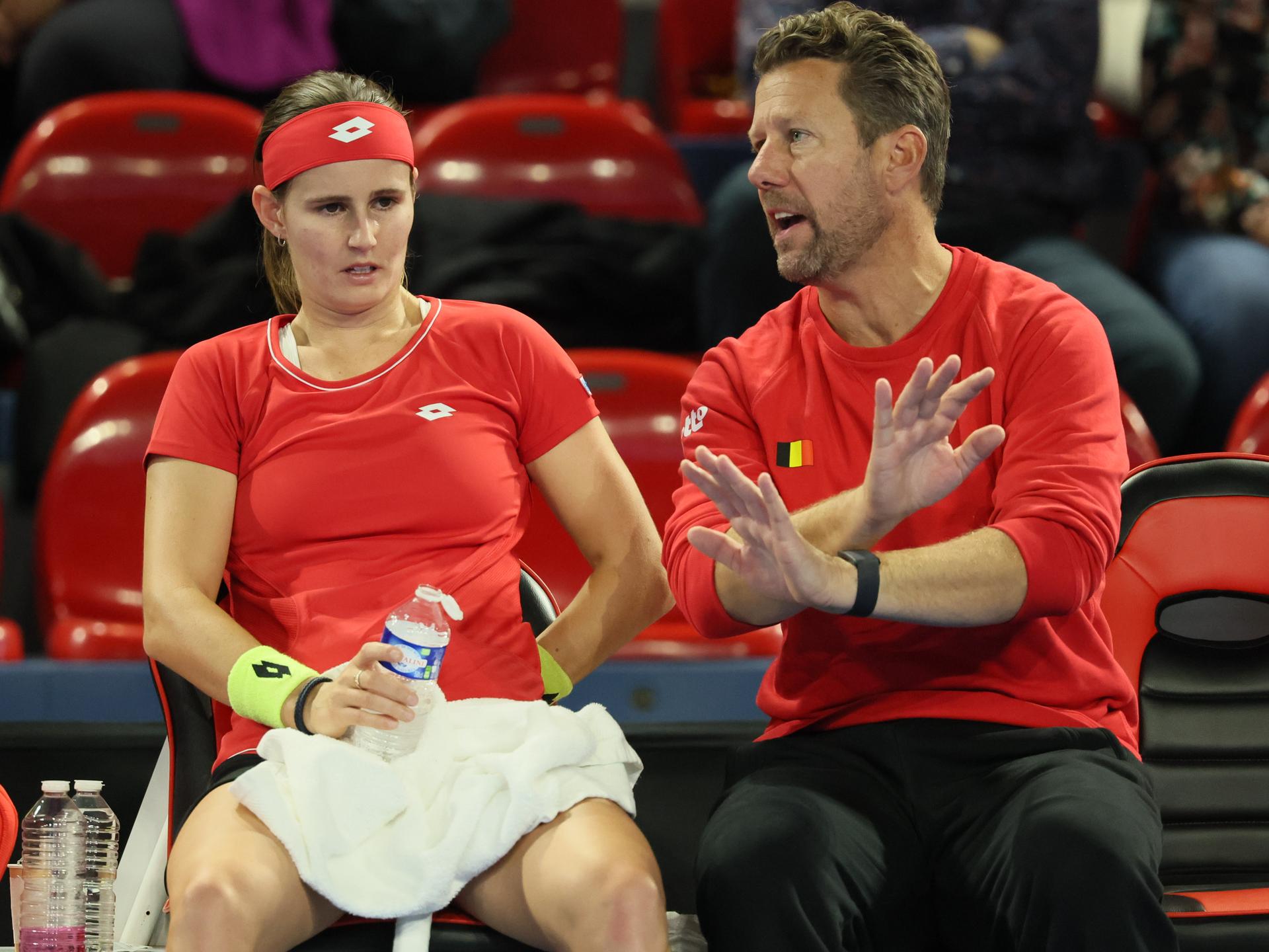 Belgian Greet Minnen and Belgian team captain Wim Fissette pictured during a tennis match between Belgian Minnen and Hungarian Galfi, the first rubber in the meeting between Belgium and Hungary in the Play-Offs for the Billie Jean King Cup tennis, on Saturday 11 November 2023 in Charleroi. BELGA PHOTO BENOIT DOPPAGNE